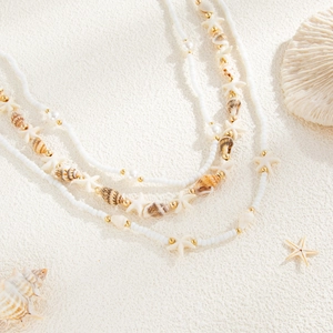 Détail de la chaîne de taille à trois couches avec étoiles de mer et coquillages