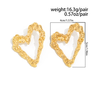 Detail of gold heart earrings with hammered texture and 4cm x 5cm size dimensions