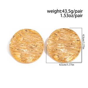 Macro shot of gold textured round earrings showing 4.5cm diameter and 43.5g weight detail