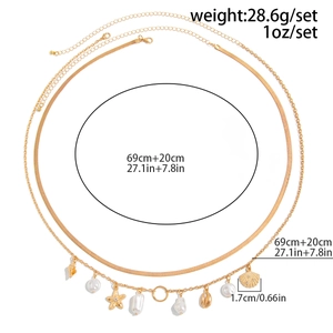 Gold multi-layer body chain featuring starfish, shell charms and faux pearls detail