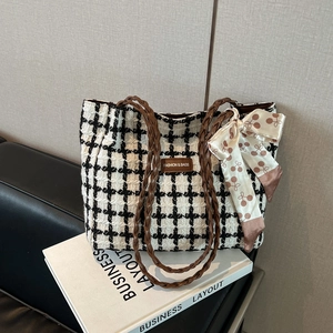 Classic black and white plaid tweed tote bag with woven handles and silk cherry scarf