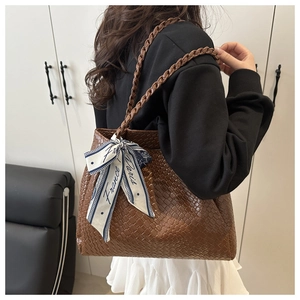 Brown woven tote bag with decorative silk scarf and spacious design for office work