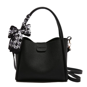 Classic black bucket bag with lychee texture and decorative black white check silk scarf