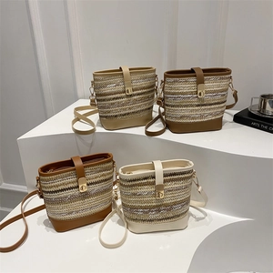 Chic woven bucket bags with leather trim in beige, brown, and cream white colors