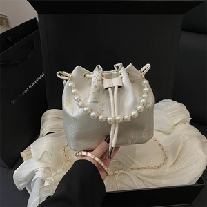 Elegant white satin bucket bag with pearl handle and bamboo embroidery for women