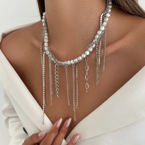 Detail of layered pearl necklace with silver chain fringe and sparkling rhinestones
