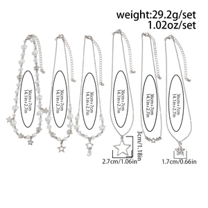 Vue détaillée du lot de 6 colliers argentés avec pendentifs étoiles et chaînes de 36 cm