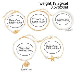 Detailed view of 5-piece beach anklet set featuring starfish and seashell charms