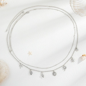 Double-layered silver waist chain with starfish, shell, and palm tree beach pendants