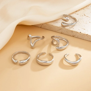Detailed shot of S925 sterling silver stamp on minimalist irregular ring set ensemble