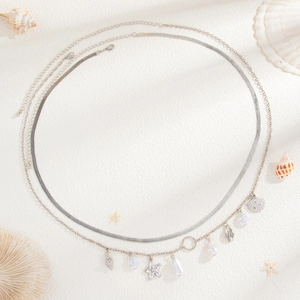 Silver layered beach body chain with seashell starfish charms and snake chain design