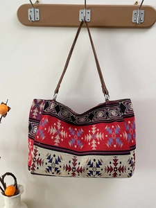 Ethnic woven tote bag with red geometric patterns and brown leather straps for women