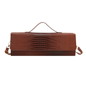 Brown crocodile pattern faux leather handbag with top handle and crossbody strap