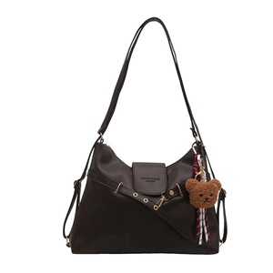 Brown leather tote bag for women with metal buckle and plush bear pendant accessory
