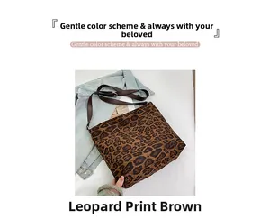 Close-up of leopard print tote bag placed on denim jacket for fashion styling