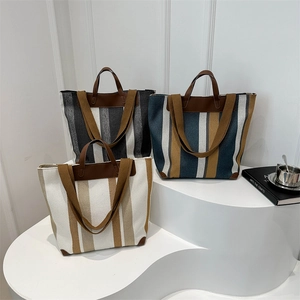 Large capacity striped canvas tote bag with leather handles and long shoulder straps