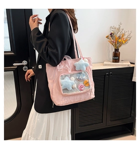 Pink ita bag tote with clear display window, star pendant and strawberry character badges