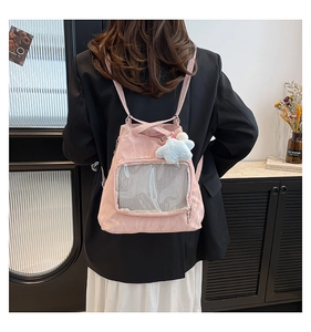Detailed view of pink Japanese style ita bag with clear mesh pocket and star pendant