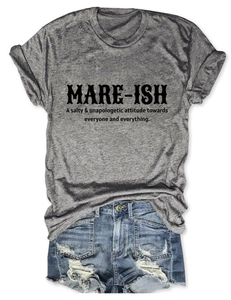 Flat lay of gray MARE-ISH slogan T-shirt paired with distressed denim shorts
