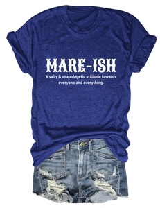 Detailed flat lay of casual blue short sleeve tee with white text and ripped denim shorts