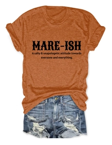 Detailed flat lay of casual orange t-shirt with Mare-ish text and ripped denim shorts