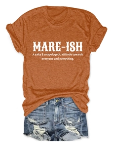 Flat lay of terracotta cotton t-shirt with MARE-ISH print and distressed denim shorts