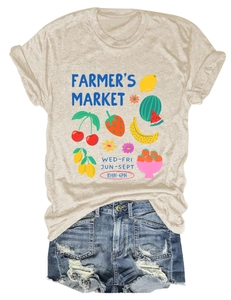 Flat lay of Farmers Market graphic t-shirt with retro fruit print and distressed denim shorts