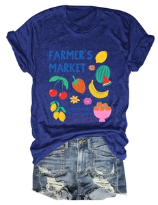 Flat lay of casual women's T-shirt with colorful fruit farmer's market print and denim shorts