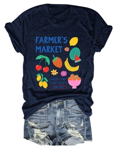 Detail of navy cotton t-shirt with colorful fruit graphic and distressed denim shorts