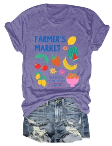 Detail of purple Farmer's Market T-shirt with fruit print and frayed denim shorts