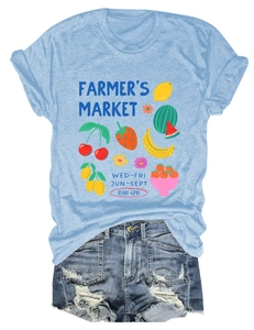 Detail showing Farmer's Market graphic with fruit motifs on light blue cotton t-shirt