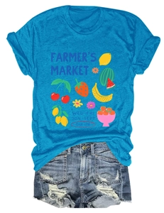 Detail view of Farmer's Market colorful fruit print on bright blue cotton t-shirt