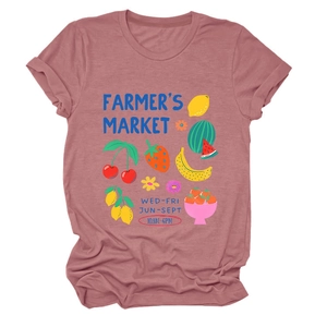 Close-up of Farmer's Market colorful fruit illustration on a dusty pink t-shirt texture