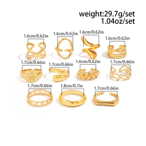 Macro view of 11-piece gold plating ring set with irregular wave and chain designs