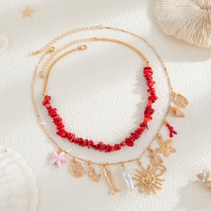Collana bohémien a doppio strato dorata con ciondoli a stella marina e corallo rosso