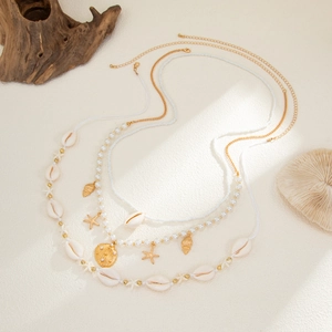 Conjunto de collares bohemios con conchas, estrellas de mar y perlas de imitación