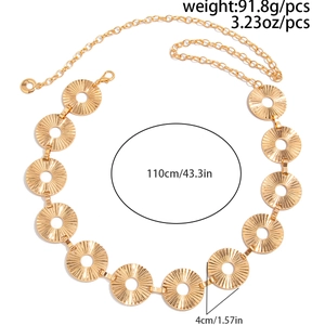 Detail view of gold punk body chain with irregular metal discs and length dimensions