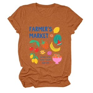 Detailed flat lay of a burnt orange t-shirt with a colorful fruit farmer's market print