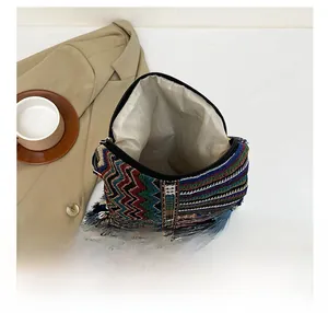 Detail showing the large interior capacity and bohemian woven texture of the tote bag