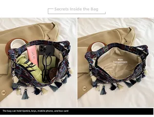 Detail view of ethnic crossbody bag interior holding folding umbrella, phone and essentials