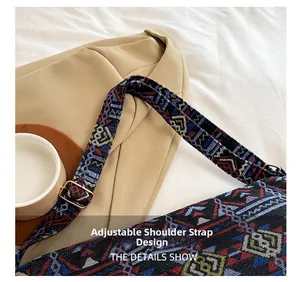Close-up of adjustable woven strap with colorful geometric patterns and gold metal buckle