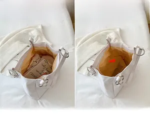 Internal view of the large capacity white tote bag showing spacious interior compartment