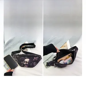 Detail view of nylon waist bag interior showing skull floral print and daily essentials