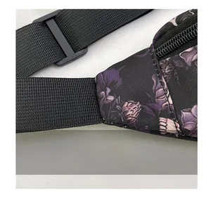 Close-up of durable reinforced shoulder strap stitching on skull print crossbody bag