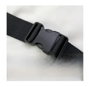 Close-up of durable black plastic buckle and woven nylon strap for chest bag