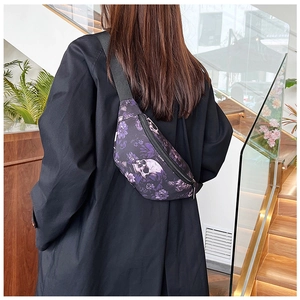 Gothic nylon waist bag featuring purple skull floral pattern worn as a crossbody on back