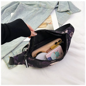 Detail view of nylon fanny pack storage capacity for phone and cosmetic items