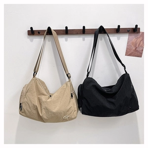 Versatile nylon crossbody bags in black and khaki with adjustable straps for travel