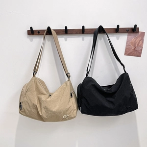 Versatile nylon bucket bag set in khaki and black with adjustable wide shoulder straps