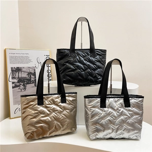 Quilted tote bags in black, gold and silver finishes with durable woven handles